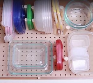 Use pegboard to keep your Tupperware in order
